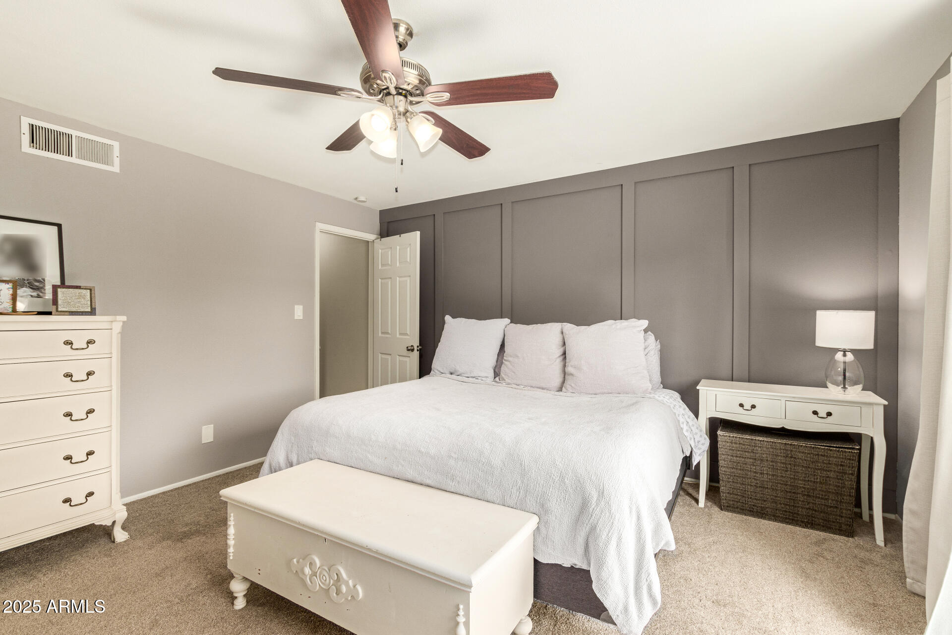 8135 North Central Avenue, Unit 7 Phoenix, AZ 85020 - Photo 12 of 25 a bedroom with a bed and a dresser