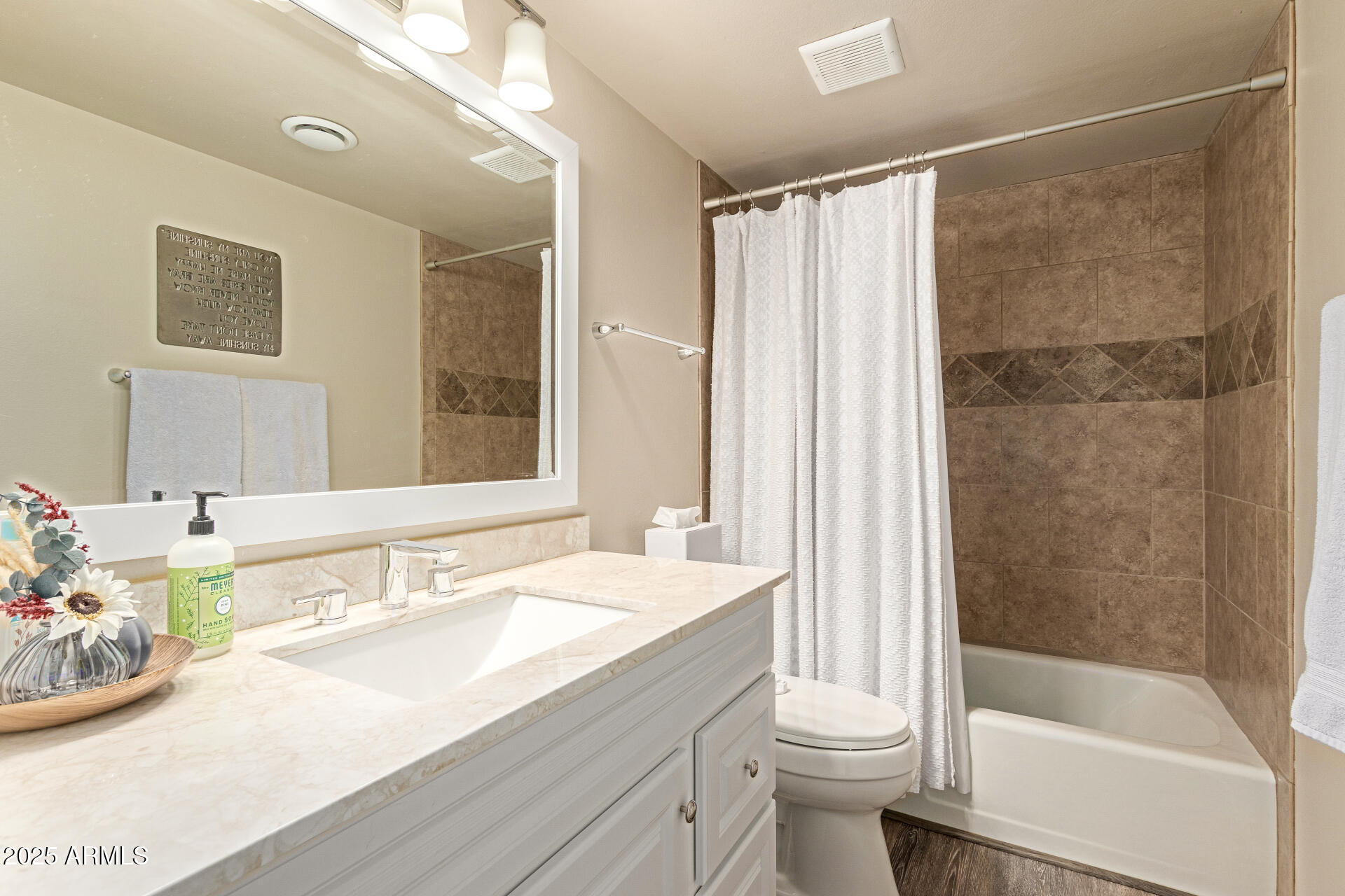 8135 North Central Avenue, Unit 7 Phoenix, AZ 85020 - Photo 19 of 25 a bathroom with a bathtub shower sink vanity and toilet