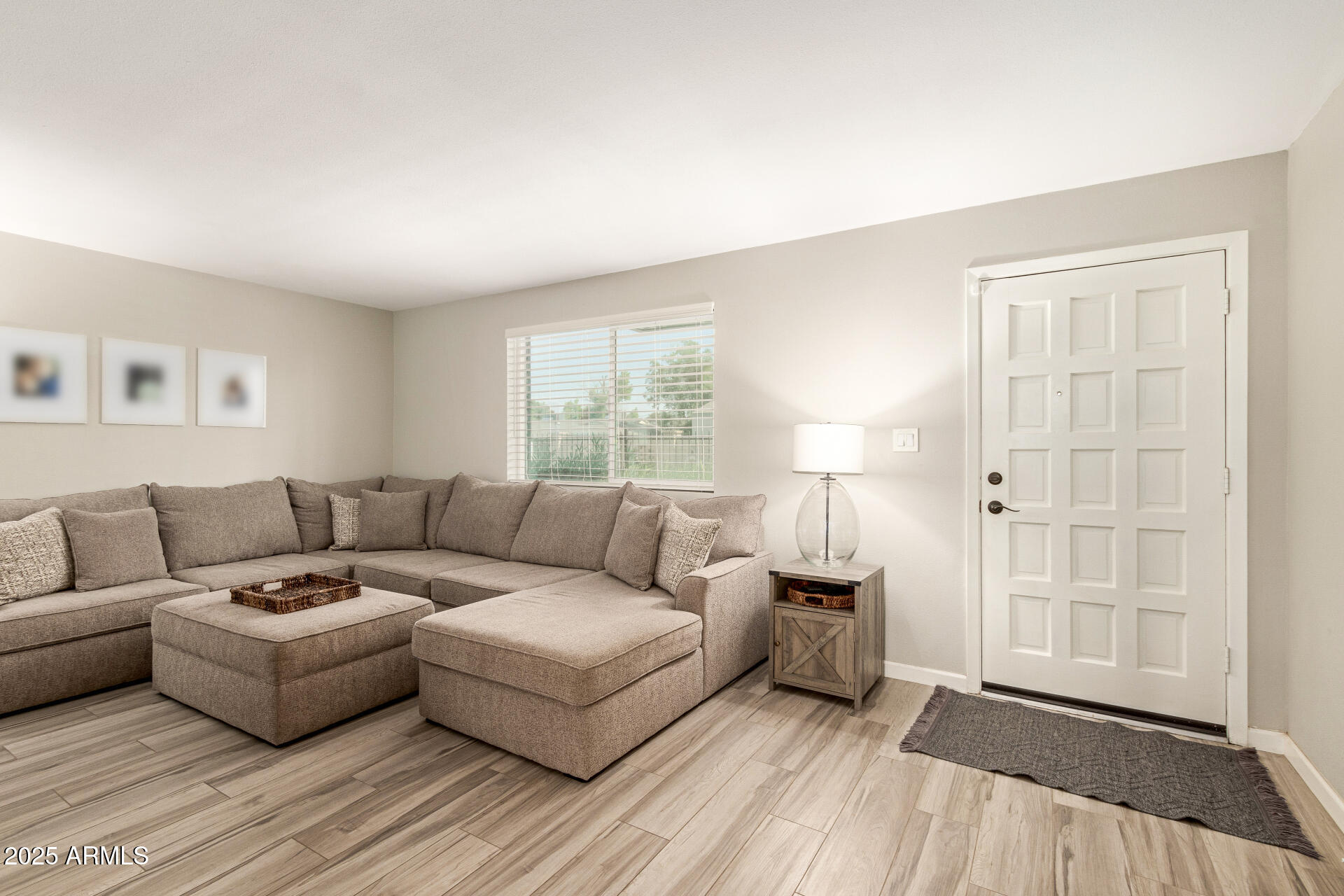 8135 North Central Avenue, Unit 7 Phoenix, AZ 85020 - Photo 2 of 25 a living room with furniture and a window