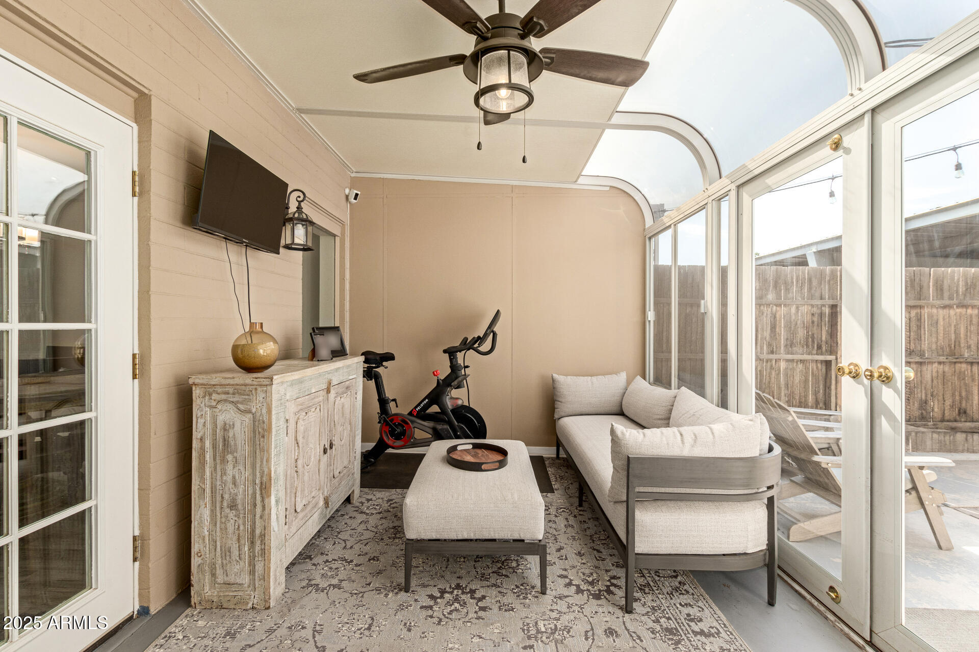 8135 North Central Avenue, Unit 7 Phoenix, AZ 85020 - Photo 21 of 25 a living room with furniture a flat screen tv and a large window