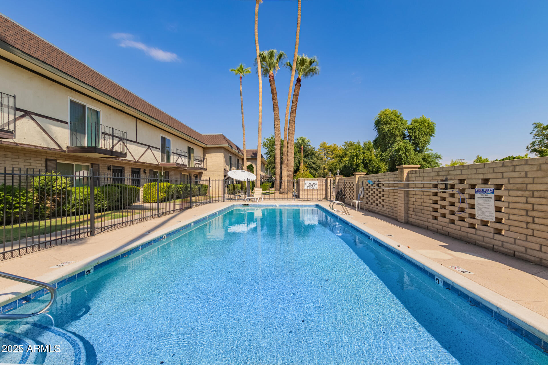 8135 North Central Avenue, Unit 7 Phoenix, AZ 85020 - Photo 23 of 25 a swimming pool with outdoor seating and yard