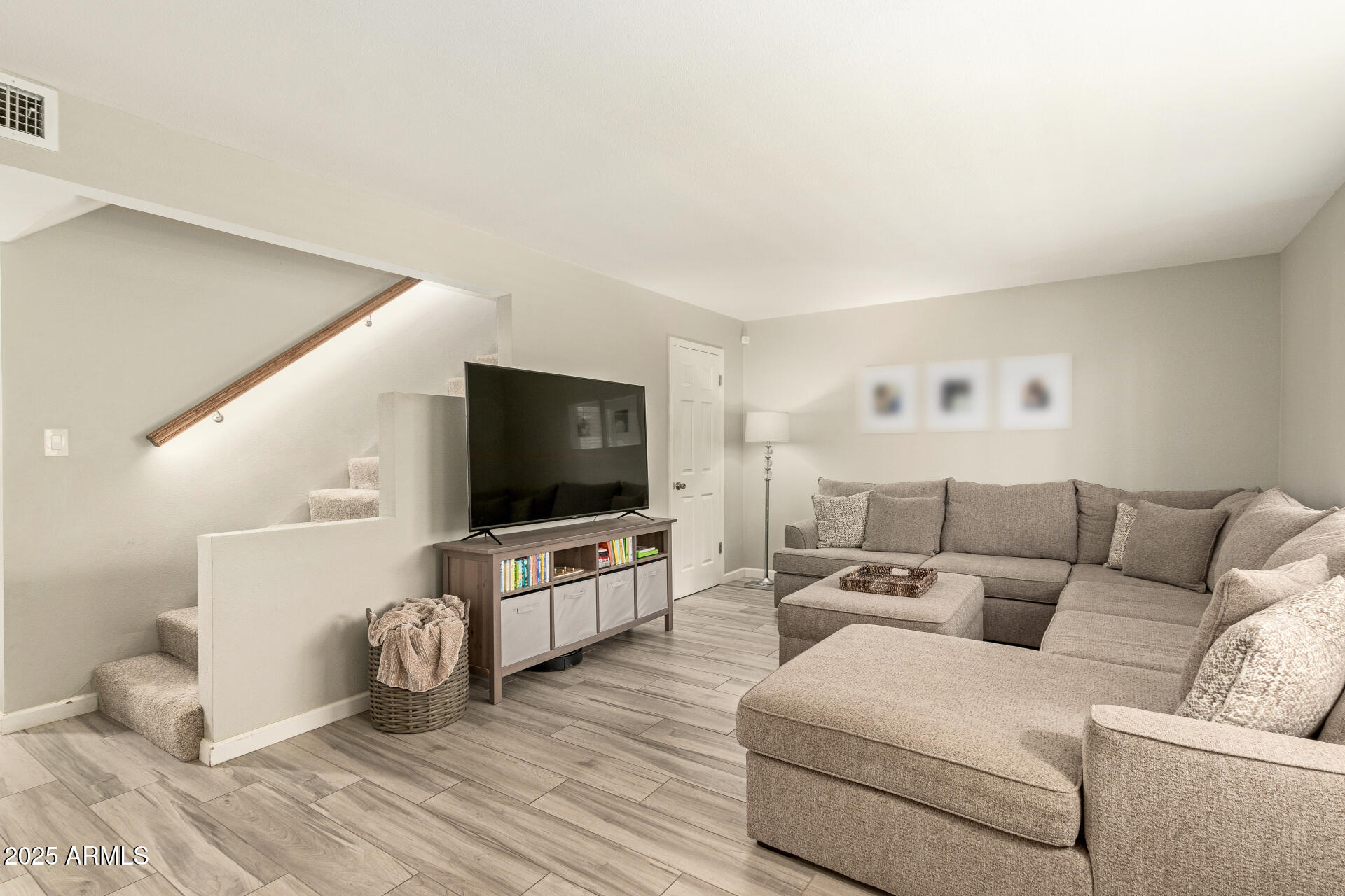 8135 North Central Avenue, Unit 7 Phoenix, AZ 85020 - Photo 3 of 25 a living room with furniture and a flat screen tv