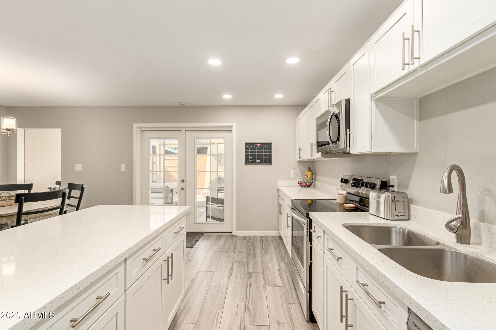 8135 North Central Avenue, Unit 7 Phoenix, AZ 85020 - Photo 7 of 25 a kitchen with a sink stove and cabinets