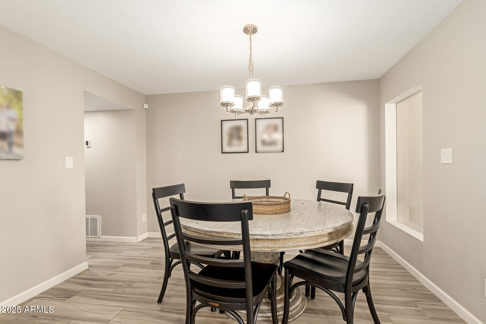 8135 North Central Avenue, Unit 7 Phoenix, AZ 85020 - Photo 8 of 25 a view of a dining room with furniture wooden floor and chandelier