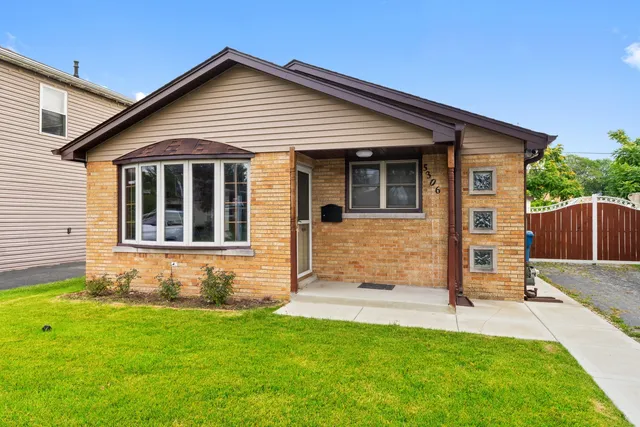 front view of a house with a yard
