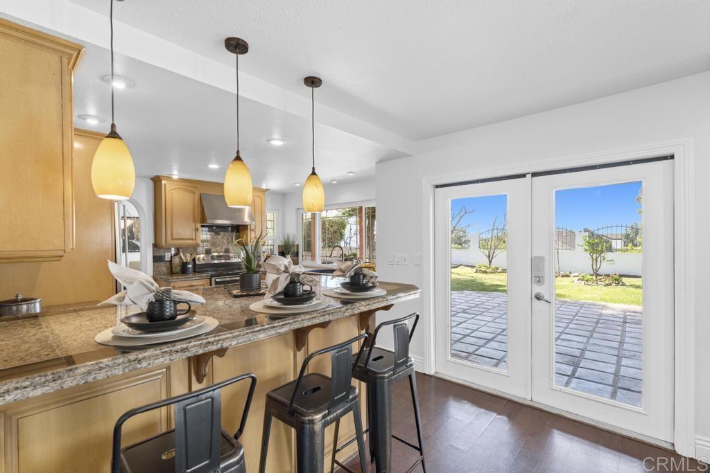 978 Roca Place Chula Vista, CA 91910 - Photo 17 of 45 a table with chairs and painting on the wall