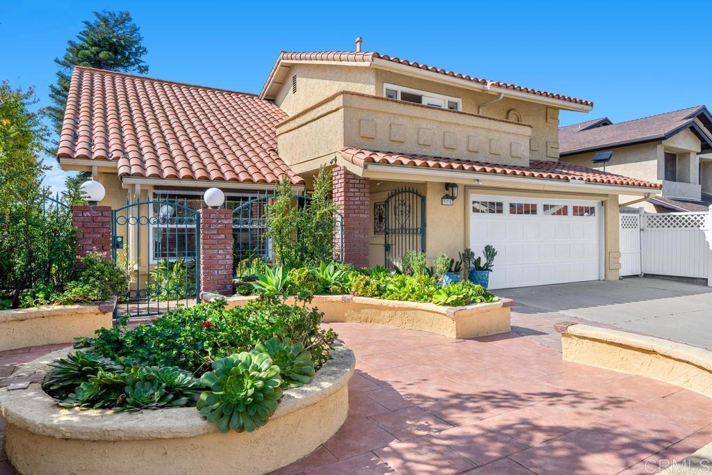 978 Roca Place Chula Vista, CA 91910 - Photo 4 of 45 a front view of a house with a yard and potted plants