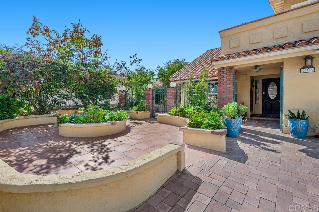 978 Roca Place Chula Vista, CA 91910 - Photo 5 of 45 a view of a house with potted plants and a bench