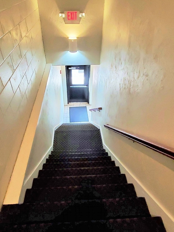 37 Central Square, Unit 37B Bridgewater, MA 02324 - Photo 13 of 15 a view of entryway and hall with wooden floor