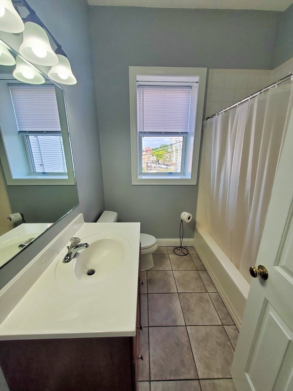 37 Central Square, Unit 37B Bridgewater, MA 02324 - Photo 6 of 15 a bathroom with a sink and a mirror