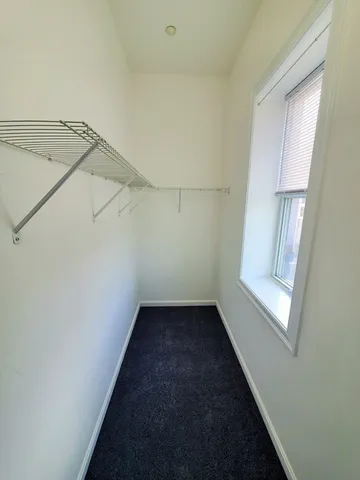 a view of a small space with racks on the wall