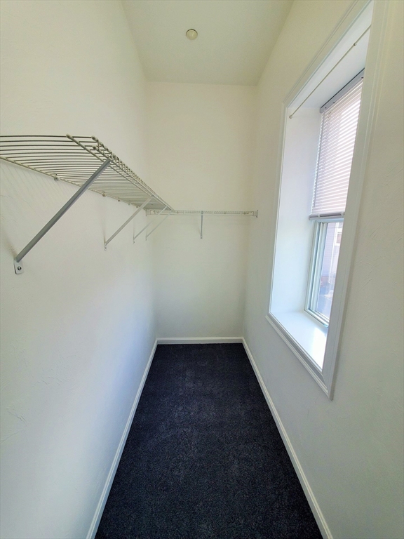 37 Central Square, Unit 37B Bridgewater, MA 02324 - Photo 7 of 15 a view of a small space with racks on the wall