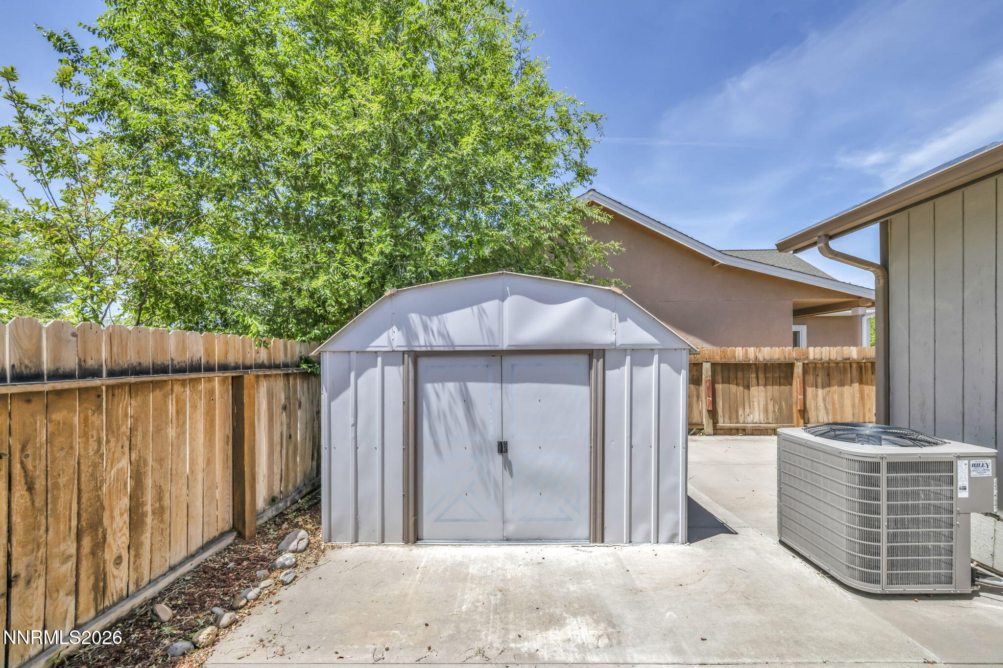 692 Lassen Way Gardnerville, NV 89460 - Photo 32 of 34 a backyard of a house with barbeque oven and outdoor seating