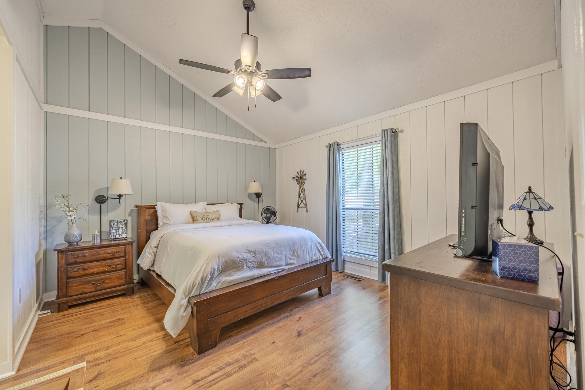 80 Contreau Road Counce, TN 38326 - Photo 12 of 28 a bedroom with a bed and a chandelier