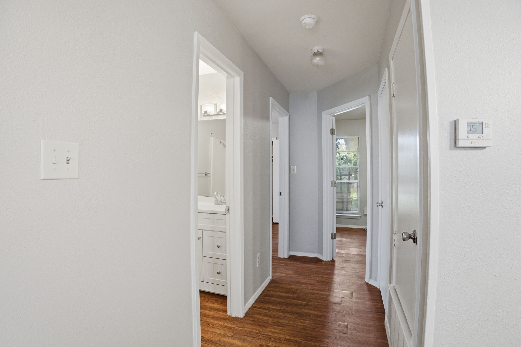 5204 Nuckols Crossing Road, Unit B Austin, TX 78744 - Photo 5 of 16 a view of a hallway with wooden floor