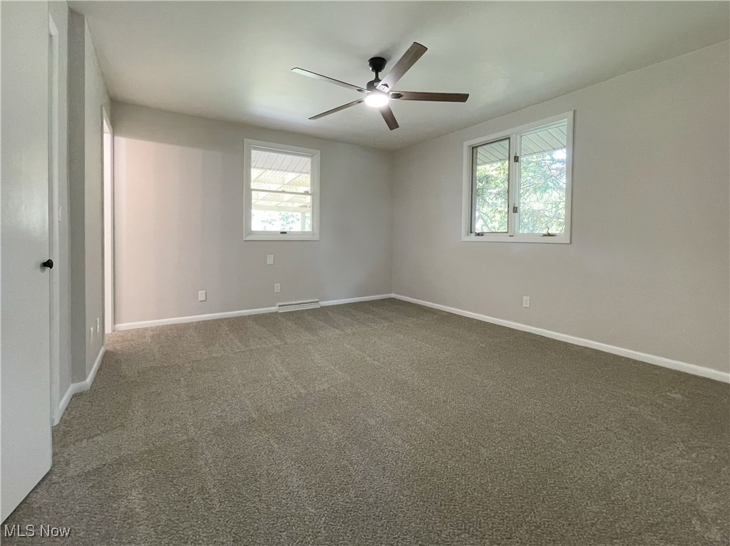 2285 Killian Road Akron, OH 44312 - Photo 9 of 32 Master bedroom with ceiling fan, new carpet and paint.