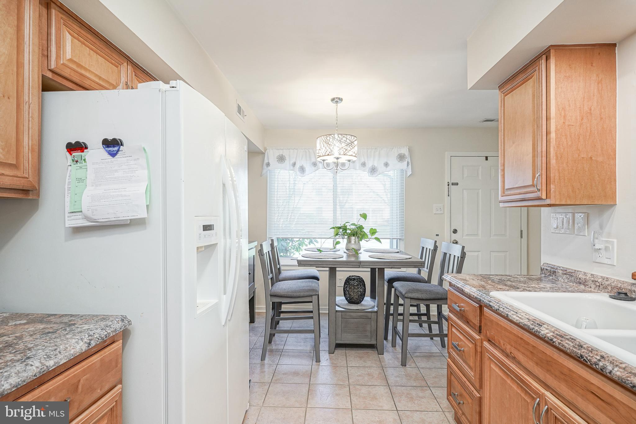 2305 Sandra Road Voorhees, NJ 08043 - Photo 7 of 24 a view of a kitchen area with furniture and window