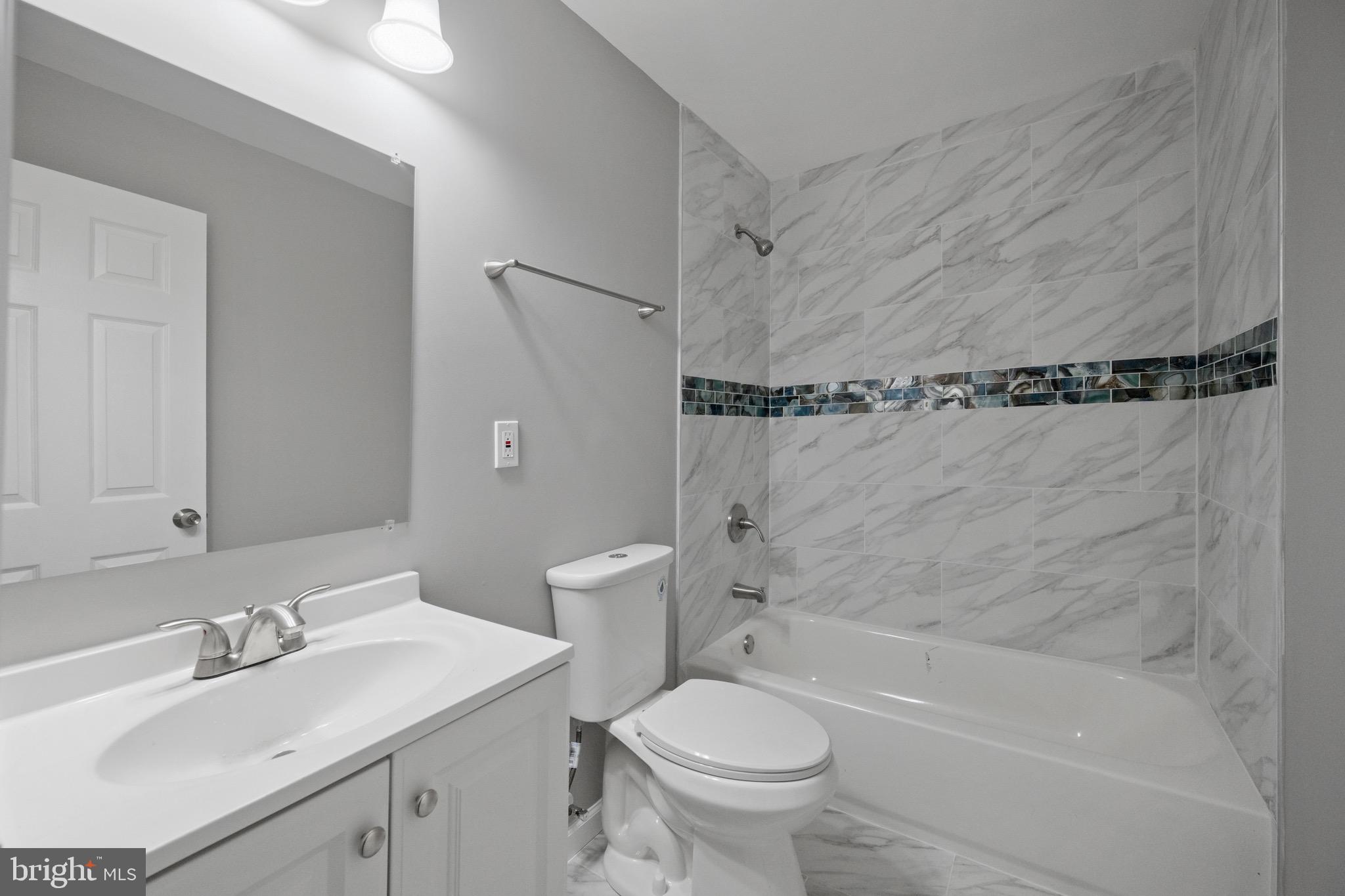 3401 Court Way Baltimore, MD 21222 - Photo 20 of 35 a bathroom with a sink toilet and shower