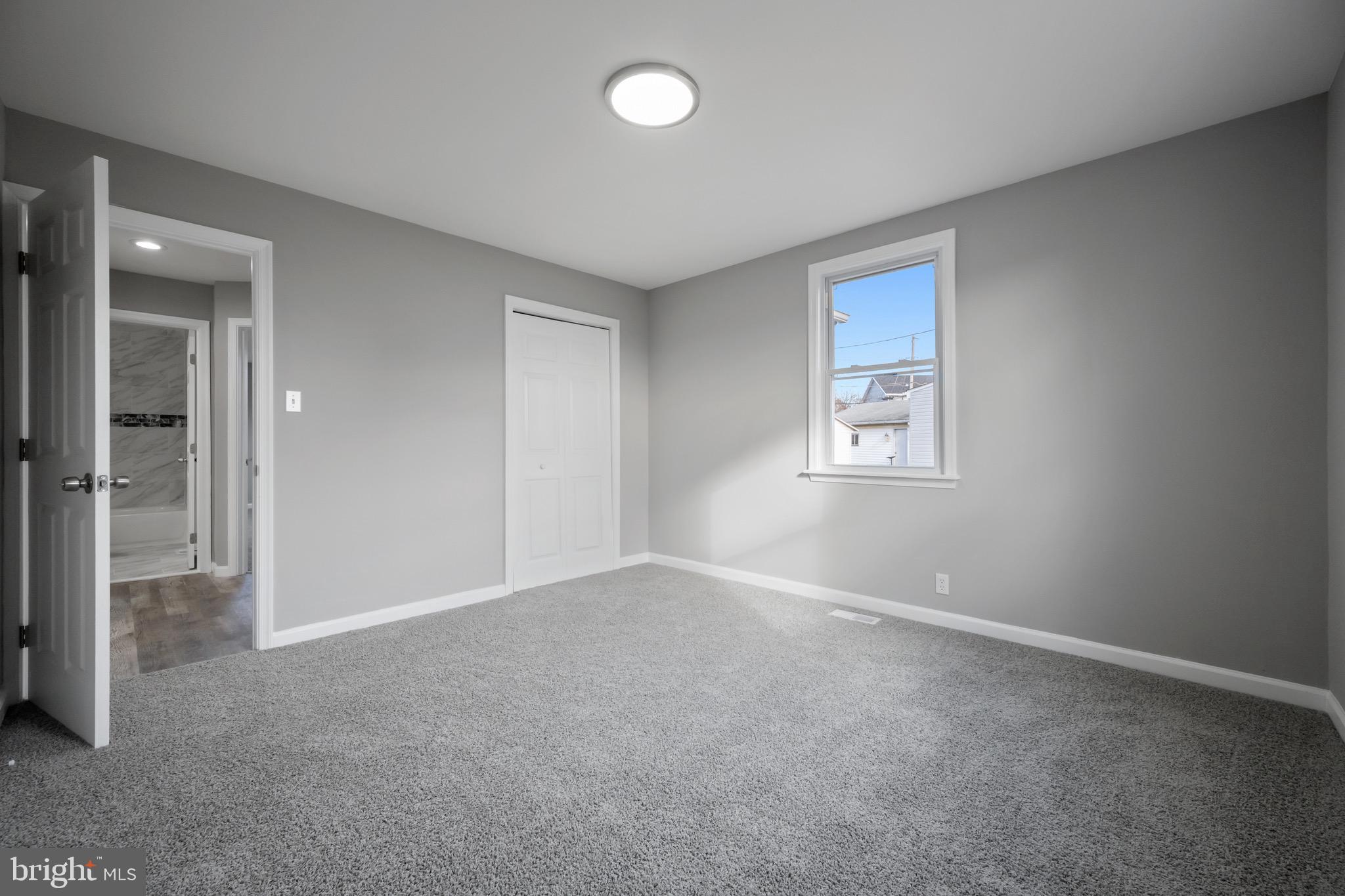 3401 Court Way Baltimore, MD 21222 - Photo 24 of 35 an empty room with windows and closet