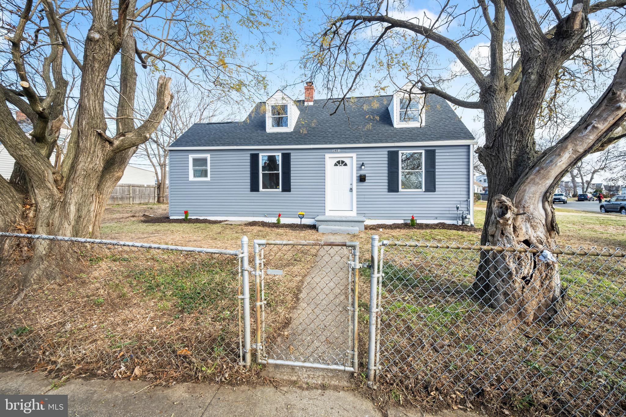 3401 Court Way Baltimore, MD 21222 - Photo 3 of 35 a front view of a house with a yard