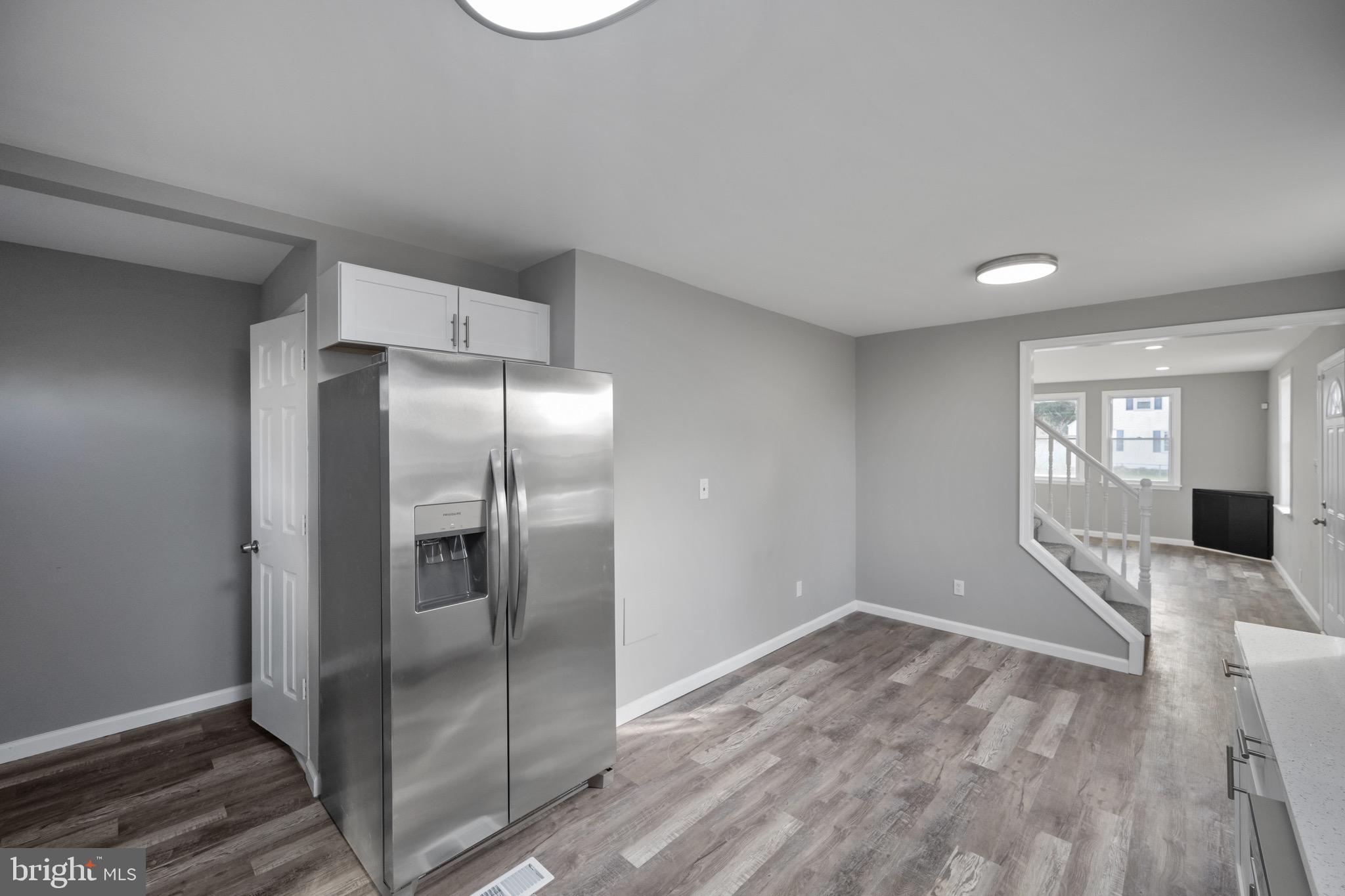 3401 Court Way Baltimore, MD 21222 - Photo 34 of 35 a view of a kitchen cabinets a refrigerator and wooden floor