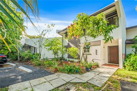 a view of a swimming pool with a yard