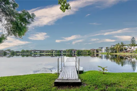 a view of a lake with houses in the back