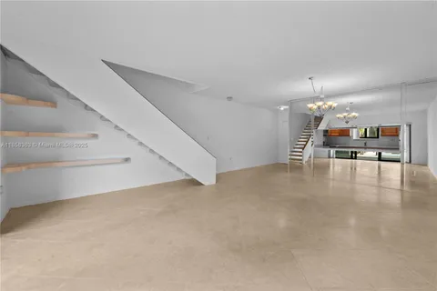 a view of a lake with houses in the back