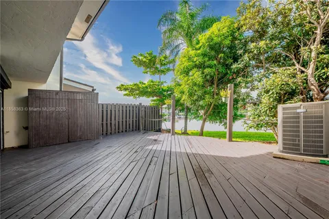 a view of a lake with houses in the back