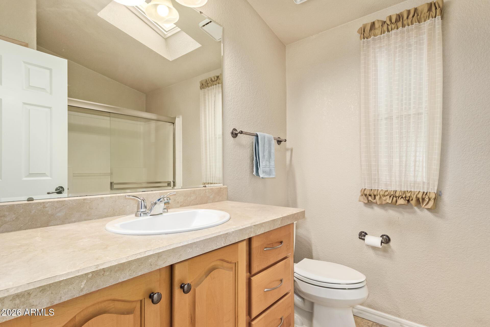 3301 South Goldfield Road, Unit 4028 Apache Junction, AZ 85119 - Photo 11 of 43 a bathroom with a sink toilet and vanity