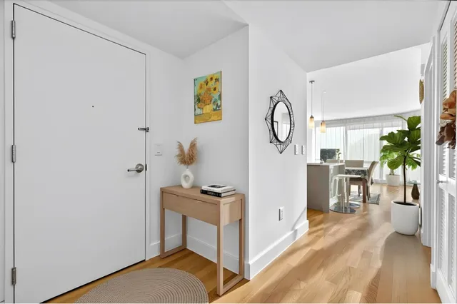 a view of room with furniture and wooden floor