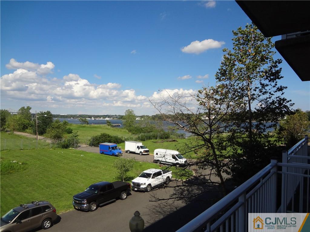 368 Rector Street, Unit 304 Perth Amboy, NJ 08861 - Photo 17 of 23 a view of a lake with a yard
