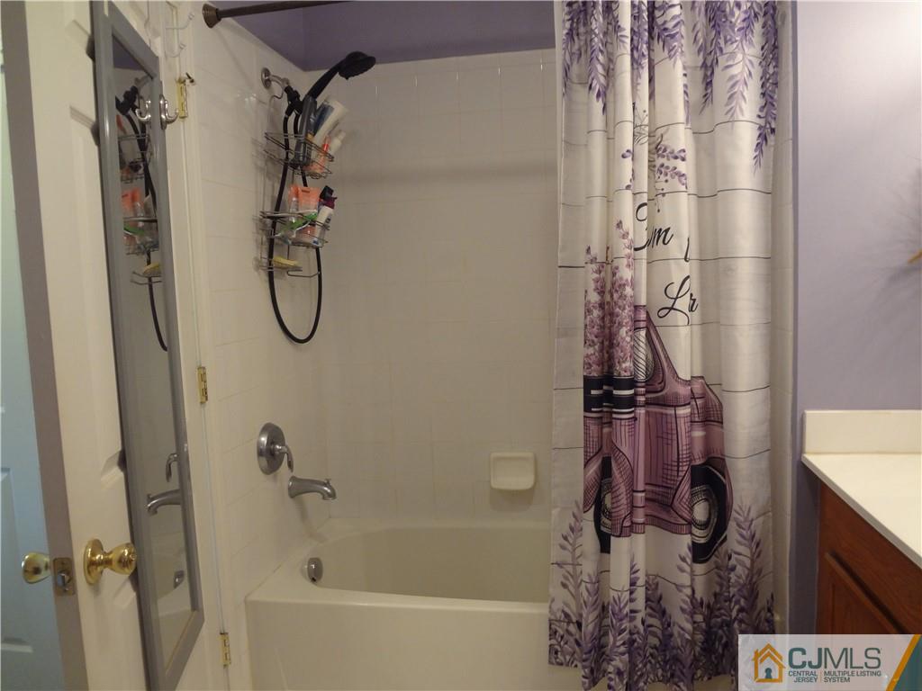 368 Rector Street, Unit 304 Perth Amboy, NJ 08861 - Photo 18 of 23 a bathroom with a shower and a tub