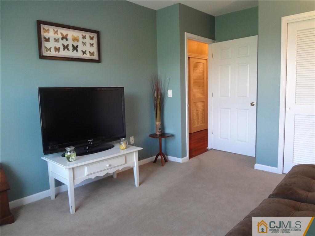 368 Rector Street, Unit 304 Perth Amboy, NJ 08861 - Photo 20 of 23 a living room with furniture and a flat screen tv