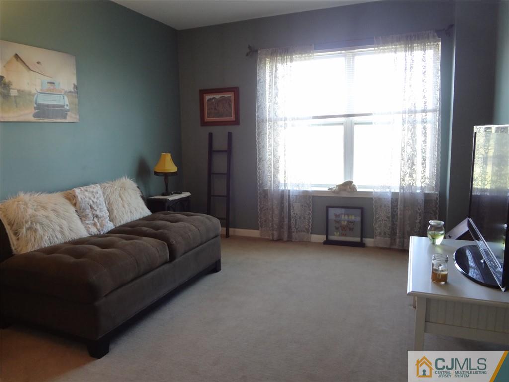 368 Rector Street, Unit 304 Perth Amboy, NJ 08861 - Photo 21 of 23 a living room with furniture and a window