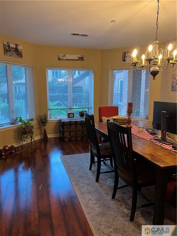 368 Rector Street, Unit 304 Perth Amboy, NJ 08861 - Photo 10 of 23 a view of a dining room with furniture window and wooden floor