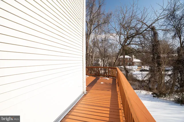 a view of balcony with wooden floor