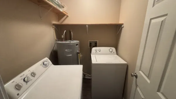 a utility room with dryer and washer