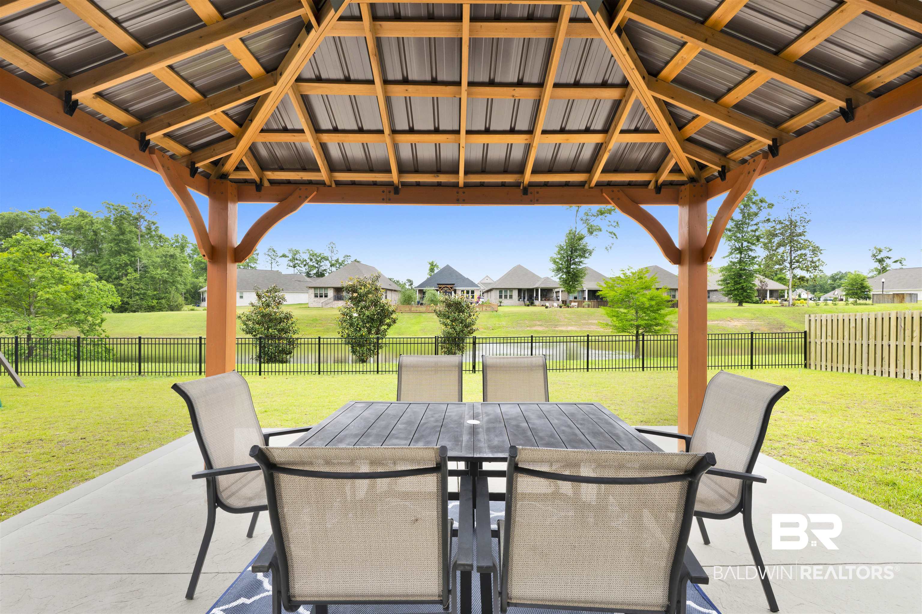 12672 Squirrel Drive Daphne, AL 36527 - Photo 37 of 49 Covered patio with a wood-frame gazebo and metal roofing