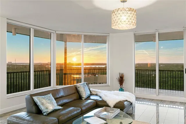a kitchen with a sink stainless steel appliances and white cabinets