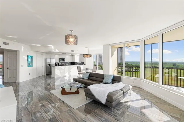 a dining room with furniture a rug and wooden floor