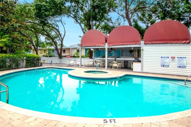 a view of a chairs and table in the patio