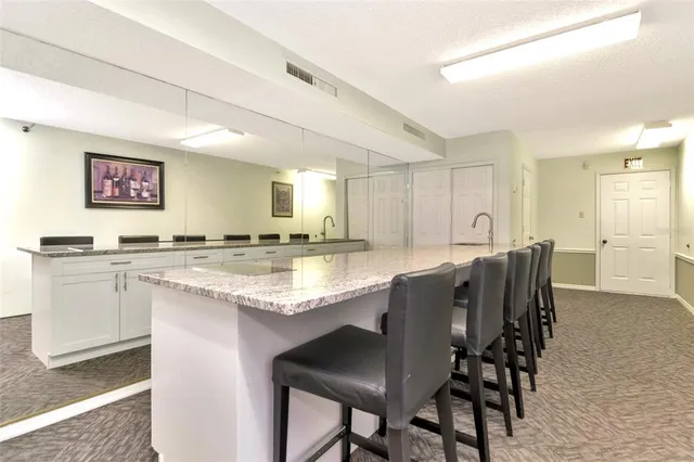 a dining room with furniture and a book shelf