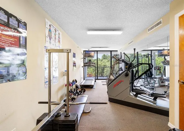 a view of parking garage with cars parked