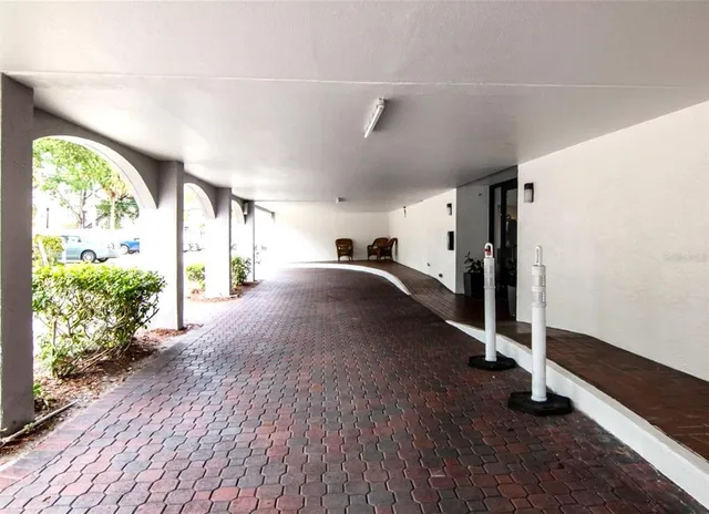 a view of a room with wooden floor and windows