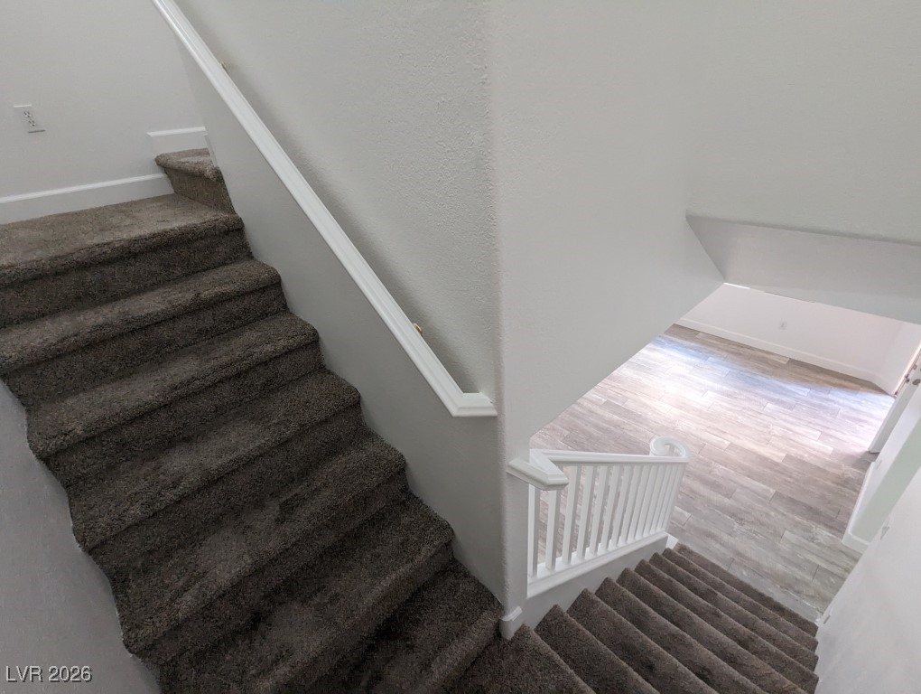 9303 Gilcrease Avenue, Unit 1137 Las Vegas, NV 89149 - Photo 14 of 30 Stairway with baseboards