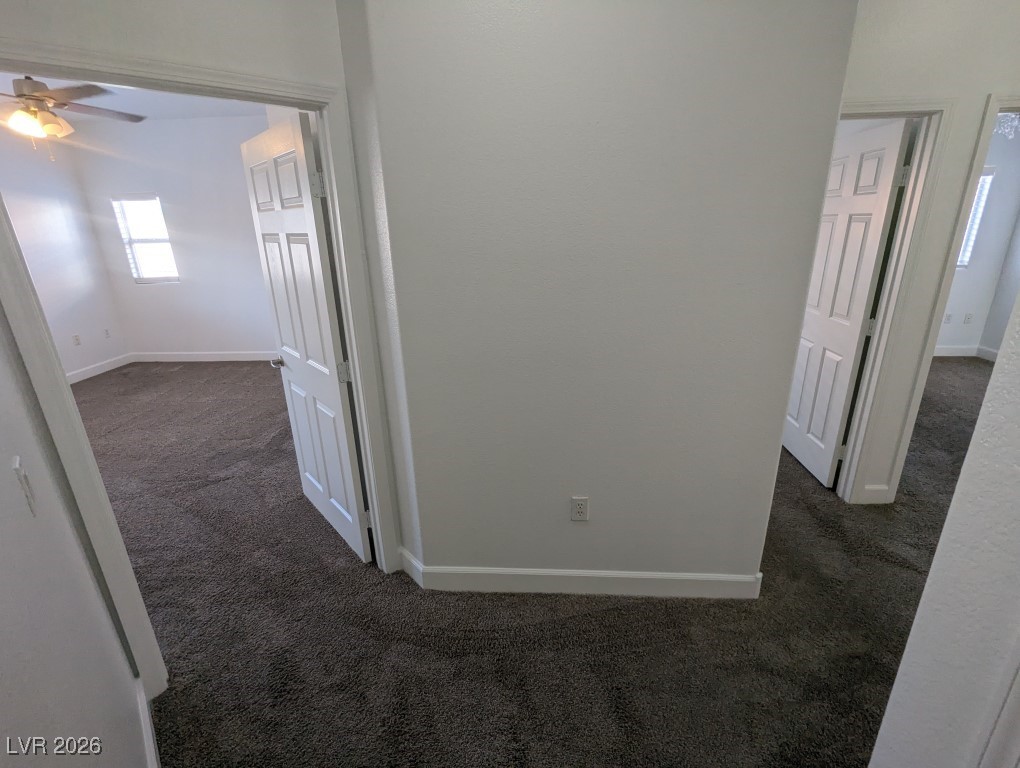 9303 Gilcrease Avenue, Unit 1137 Las Vegas, NV 89149 - Photo 16 of 30 Hallway with dark colored carpet