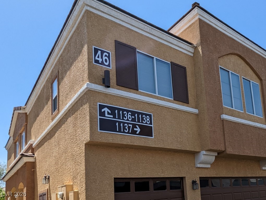 9303 Gilcrease Avenue, Unit 1137 Las Vegas, NV 89149 - Photo 2 of 30 View of building exterior with a garage