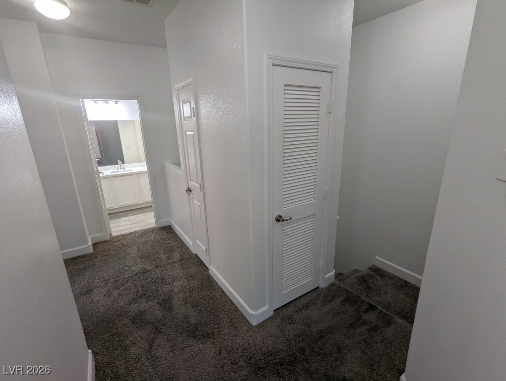 9303 Gilcrease Avenue, Unit 1137 Las Vegas, NV 89149 - Photo 23 of 30 Hall with dark colored carpet
