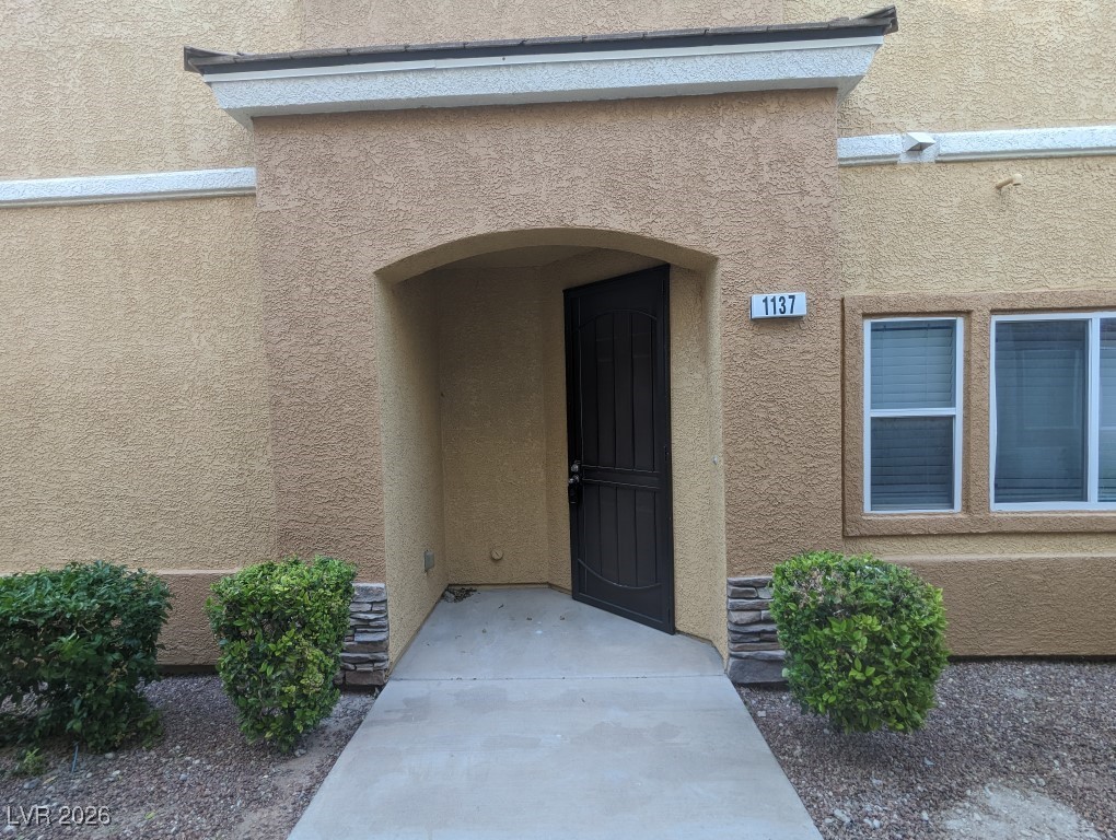 9303 Gilcrease Avenue, Unit 1137 Las Vegas, NV 89149 - Photo 3 of 30 Entrance to property featuring stucco siding